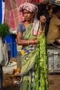 Indian seller woman with leaves garland on Flower market at Mallick Ghat in Kolkata. India Royalty Free Stock Photo