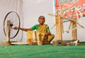 Indian senior woman spinning thread for handloom