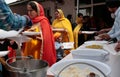 Indian sikh women take their lunch in their temple during Baisakhi celebration in Mallorca