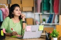 Indian small businesswoman office busy planning business or sales growth at ecommerce warehouse - concept of