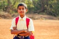 Indian smart boy arms crossed looking at camera in backyard Royalty Free Stock Photo