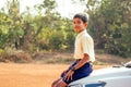 Indian smart boy arms crossed looking at camera in backyard Royalty Free Stock Photo