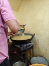 Indian snack chakli making process a worker making fresh chakli for costomer closeup photo food lovers Royalty Free Stock Photo