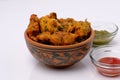 Indian snack pakora with tomato sauce or chutney Royalty Free Stock Photo