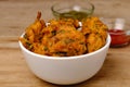 Indian snack pakora with tomato sauce or chutney Royalty Free Stock Photo