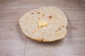 Indian special flat bread also known as butter tandoori roti or naan, served in a white ceramic quarter plate Royalty Free Stock Photo