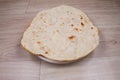 Indian special flat bread also known as tandoori roti or naan, served in a white ceramic quarter plate Royalty Free Stock Photo