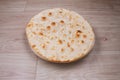 Indian special flat bread also known as tandoori roti or naan, served in a white ceramic quarter plate Royalty Free Stock Photo