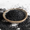 Indian spice Black cumin nigella sativa or kalonji seeds in bowl close up