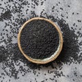 Indian spice Black cumin nigella sativa or kalonji seeds in bowl top view