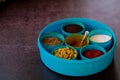 Indian spice box on wooden background with copy space,Cardamom, turmeric, chilli powder, salt,mustard seeds,cumin, selective focus Royalty Free Stock Photo
