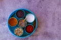 Indian spice box on wooden background with copy space,Cardamom, turmeric, chilli powder, salt,mustard seeds,cumin, selective focus Royalty Free Stock Photo