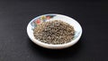 indian spice cumin seeds in bowl isolated on black background Royalty Free Stock Photo