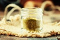 Indian spice garam masala in a glass jar, selective focus