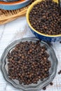 Indian spices collection, dried black peppercorns, kitchen spices Royalty Free Stock Photo