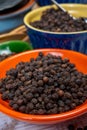 Indian spices collection, dried black peppercorns, kitchen spices Royalty Free Stock Photo