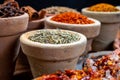 Indian spices collection, dried colorful condiment, nuts, pods and seeds and another spices in clay bowls Royalty Free Stock Photo