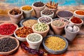 Indian spices collection, dried colorful condiment, nuts, pods and seeds and another spices in clay bowls Royalty Free Stock Photo