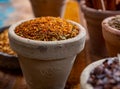 Indian spices collection, dried herbs and another spices in clay bowls