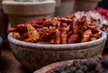 Indian spices collection, dried red hot chili peppers and another spices in clay bowls