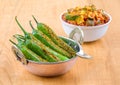 Indian Spicy Green Chilli Pickle with Mango Pickle on Wooden Background Royalty Free Stock Photo