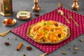 Indian spisy food Paneer Tikka biryani with raita and gulab jamun Served in a dish side view ramdan food on grey background
