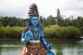 Indian statues on the background of the lake in Mauritius. Grand Bassin. Royalty Free Stock Photo