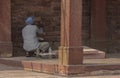 Indian stone mason making renovations to a fort