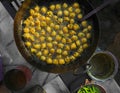 Indian Street Food Group of Frying Pakora or Bhajiya in oil