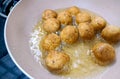 An Indian Street Food Group of Frying Pakora or Bhajiya in oil