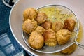 An Indian Street Food Group of Frying Pakora or Bhajiya in oil