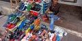 an indian street footwear shopkeeper standing inside the store