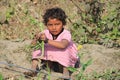 Indian Street Kid playing on a field Royalty Free Stock Photo