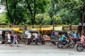 Indian street market with people driving motorcycles and cars near Mahabodhi Temple at Bodh Gaya, Bihar, India