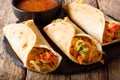 Indian street Veg roll Frankie stuffed with vegetables close-up. horizontal Royalty Free Stock Photo