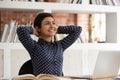 Indian student girl accomplish study resting put hands behind head