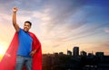 Indian superhero makes winning gesture in city Royalty Free Stock Photo