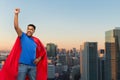 Indian superhero makes winning gesture in city Royalty Free Stock Photo