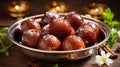 Sweet Gulab Jamun in Metal Bowl