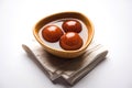 Indian sweet Gulab Jamun served in a ceramic bowl, selective focus Royalty Free Stock Photo