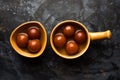 Indian sweet Gulab Jamun served in a ceramic bowl, selective focus Royalty Free Stock Photo