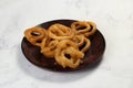 indian sweets deep fired jalebi, jilipi, jilabi served in a dish isolated on background top view Royalty Free Stock Photo