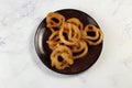 indian sweets deep fired jalebi, jilipi, jilabi served in a dish isolated on background top view Royalty Free Stock Photo