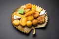 Indian sweets or Mithai for diwali festival with oil lamp or diya and gift box Royalty Free Stock Photo