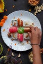 Indian sweets in a plate including cutlus, sandwich, barfi, petha garnished with almond, pistachio, cashews Royalty Free Stock Photo