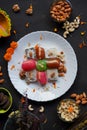 Indian sweets in a plate including cutlus, sandwich, barfi, petha garnished with almond, pistachio, cashews Royalty Free Stock Photo