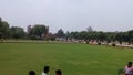 Indian Taj Mahal ticket band ground. Some people sitting on ground and enjoy Taj Mahal garden. there is very beautiful peaceful.
