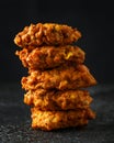 Indian takeaway food, spicy onion bhajis on black plate Royalty Free Stock Photo