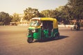 Indian taxi stands on the street against