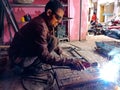 an indian technician doing welding work at service center in India January 2020 Royalty Free Stock Photo